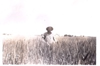 1944-Albert-our farm-behind him.jpg